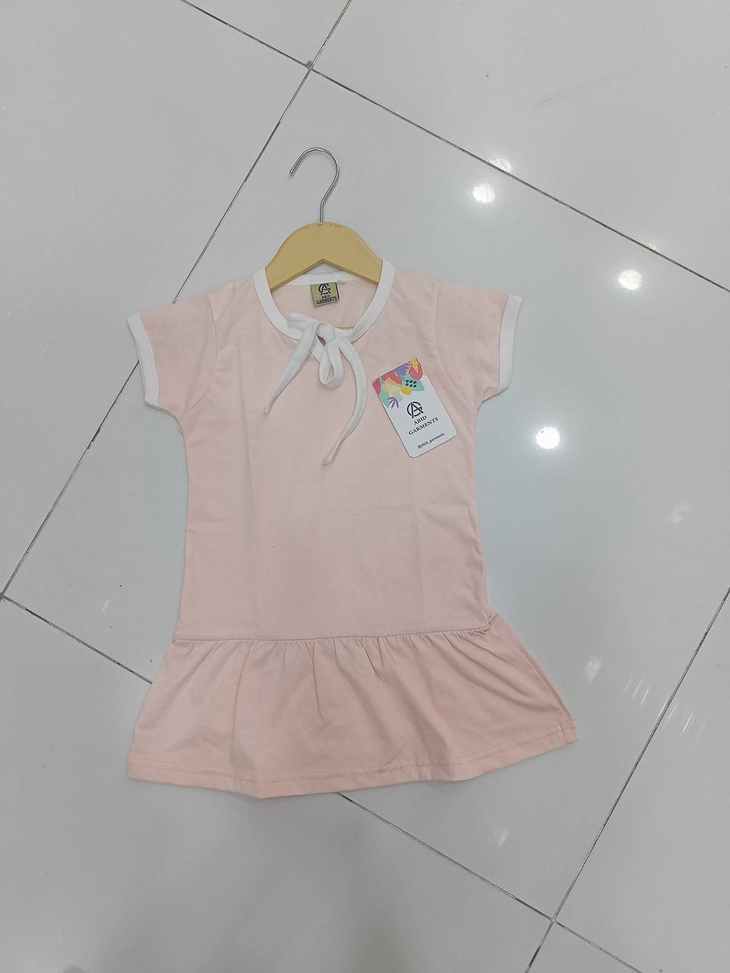 Pastel pink drop-waist shirts